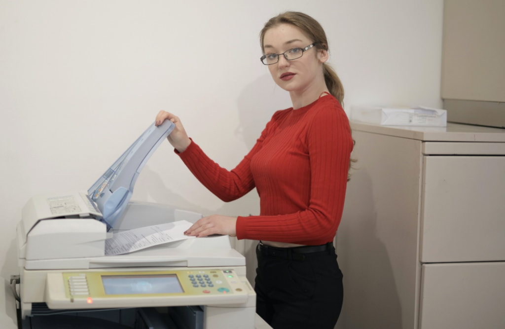 A Person Using Multifunction Printer