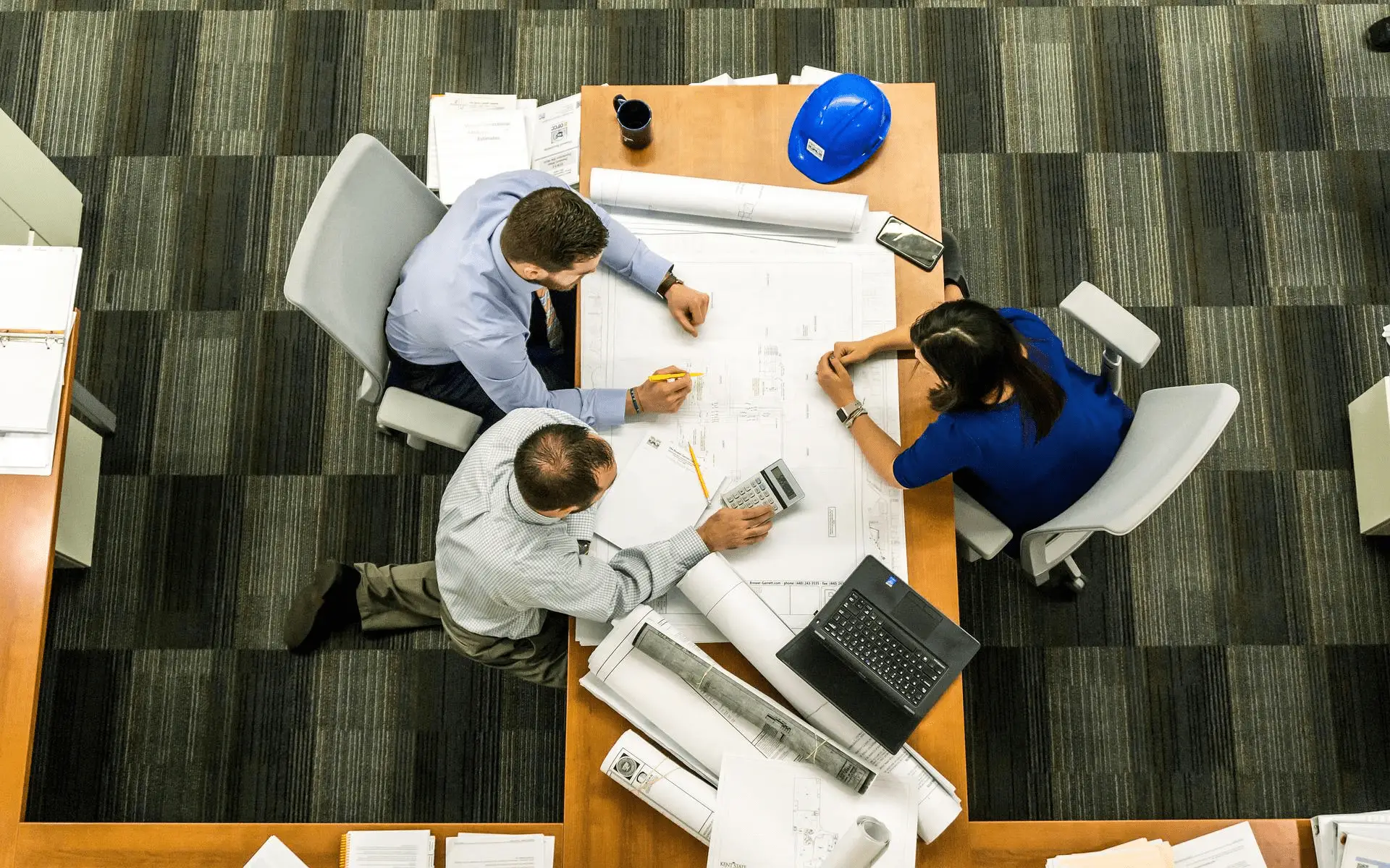 Three employees working on a project