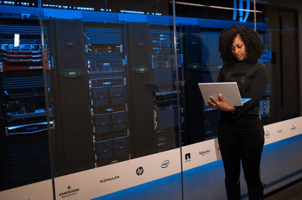 a person next to server racks