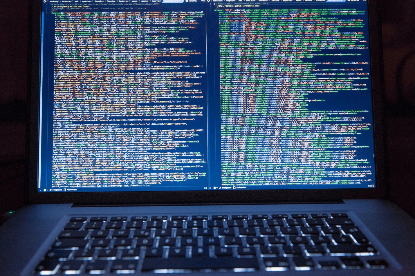 A laptop displaying encrypted data or code