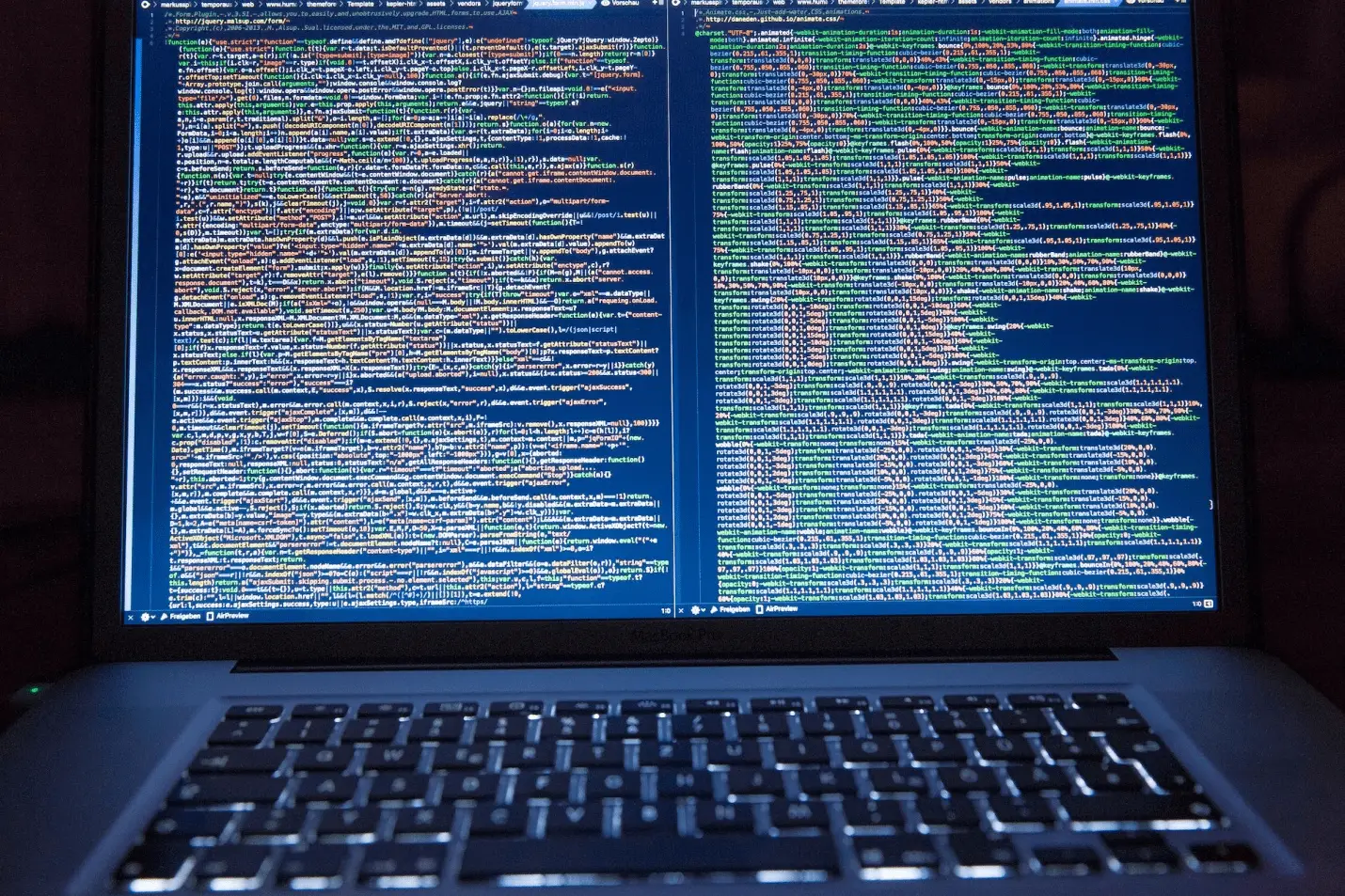 A laptop displaying encrypted data or code