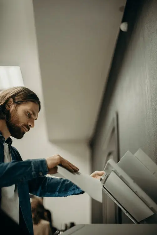 A person using a printer in the workplace