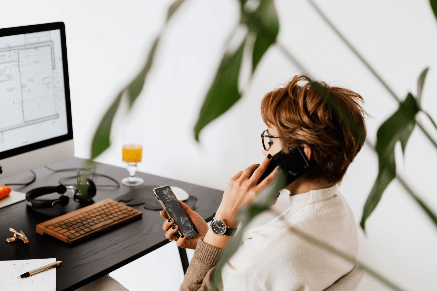 A woman talking on the phone at work
