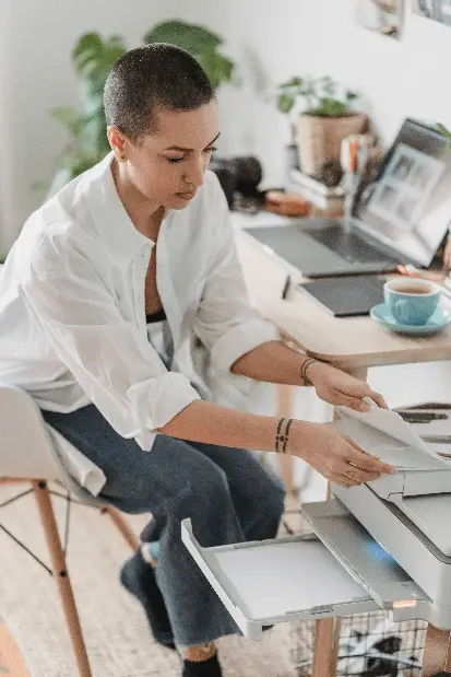 a person using a laser printer